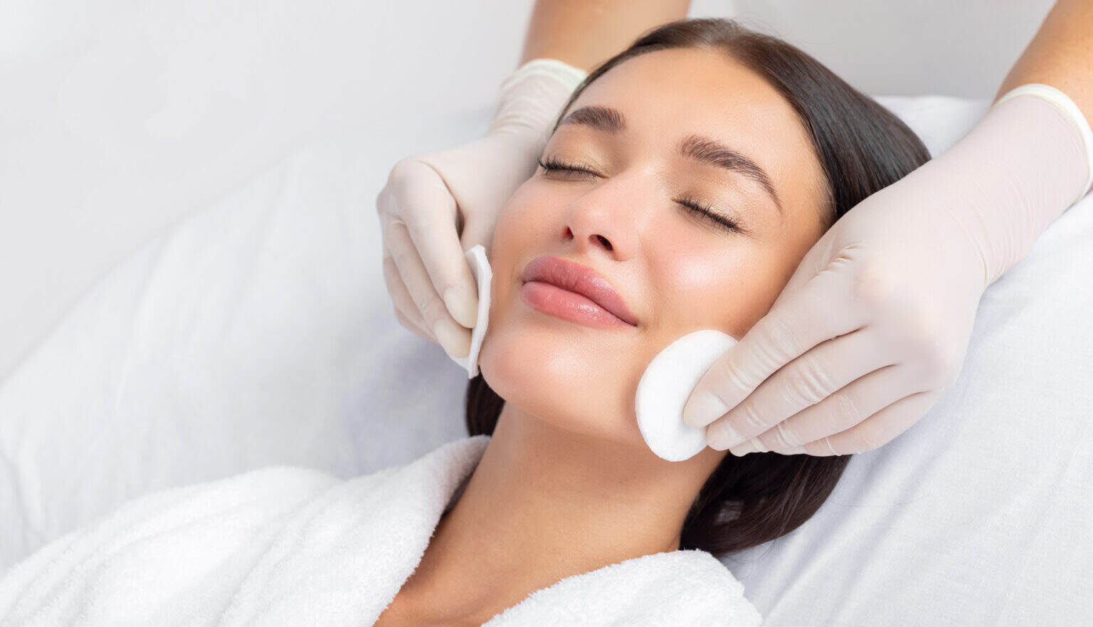 Woman receiving facial treatment at My Onenail SPA for relaxation and skincare.