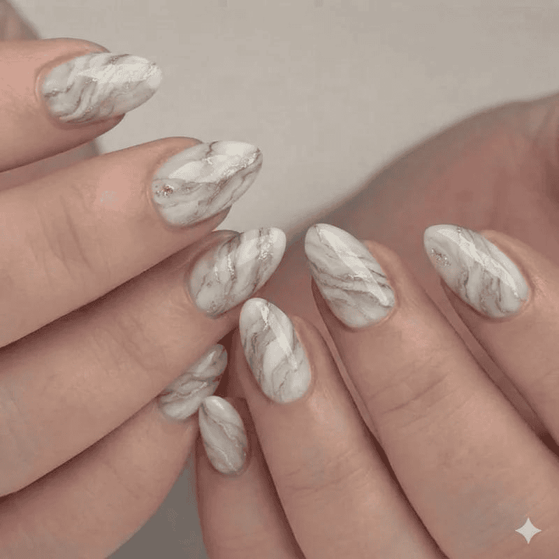 Marble nail art design on well-manicured nails at My Onenail SPA.